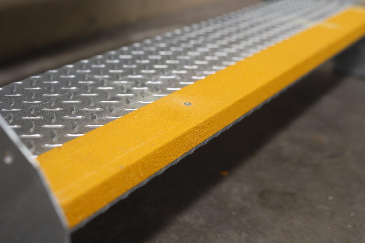 RAPTA Heavy Duty Steel Steps – Double Tread with yellow non-slip strip close up of tread