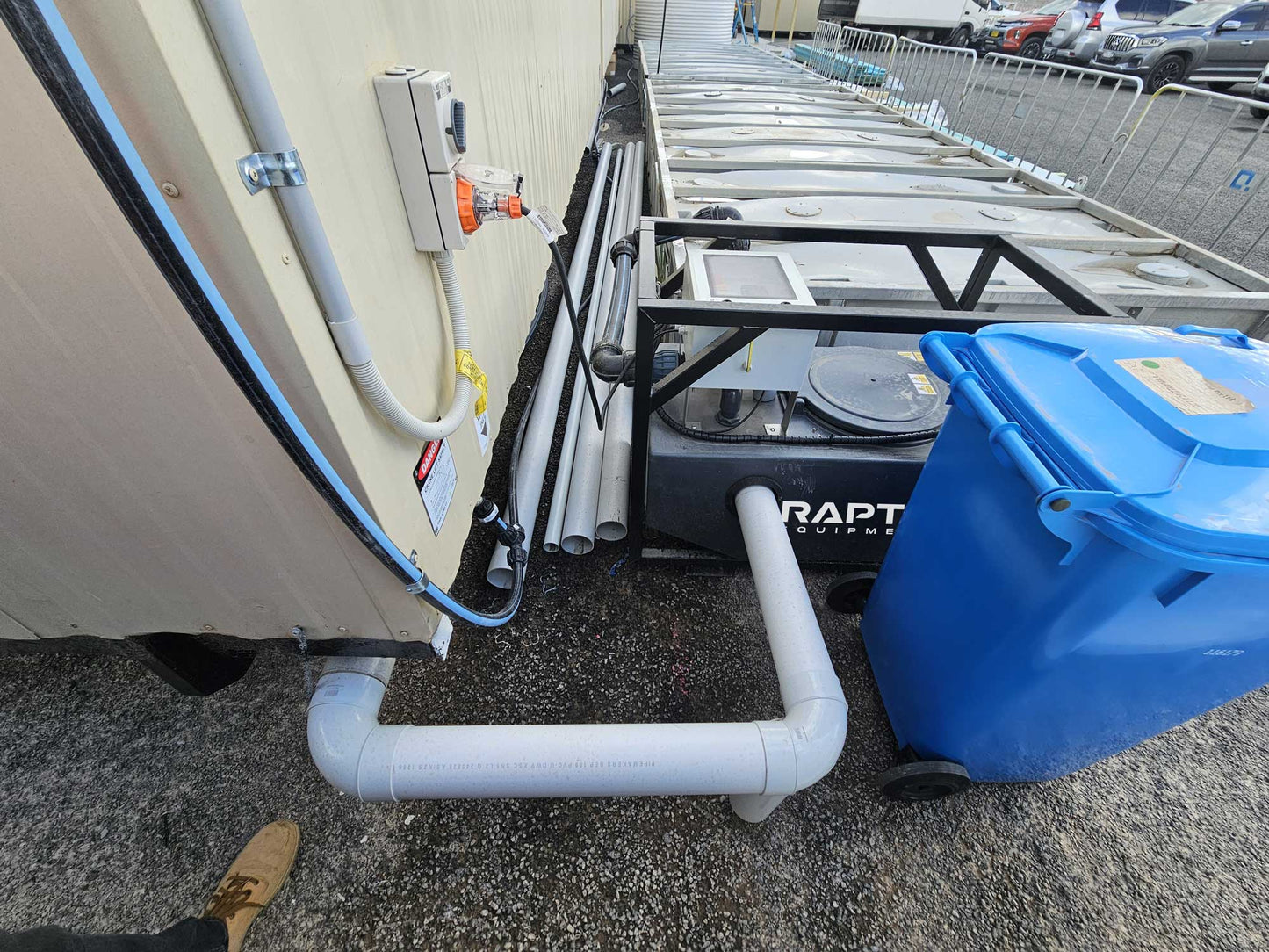 RAPTA CabinPump Ultra connected to modular site amenities with wastewater pipework and 15A power supply