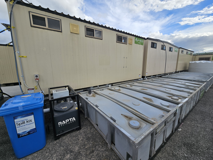 RAPTA CabinPump Ultra connected to modular site amenities and remote bulk wastewater storage tanks