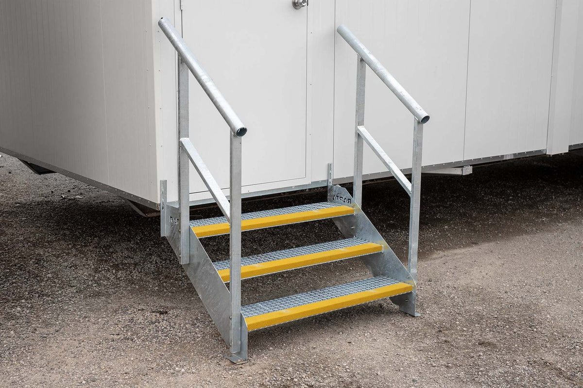 Rapta Heavy Duty Steel Steps with three treads and handrail installed at a modular building entrance