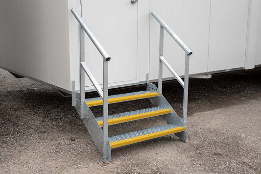 Rapta Heavy Duty Steel Steps with three treads and handrail installed at a modular building entrance