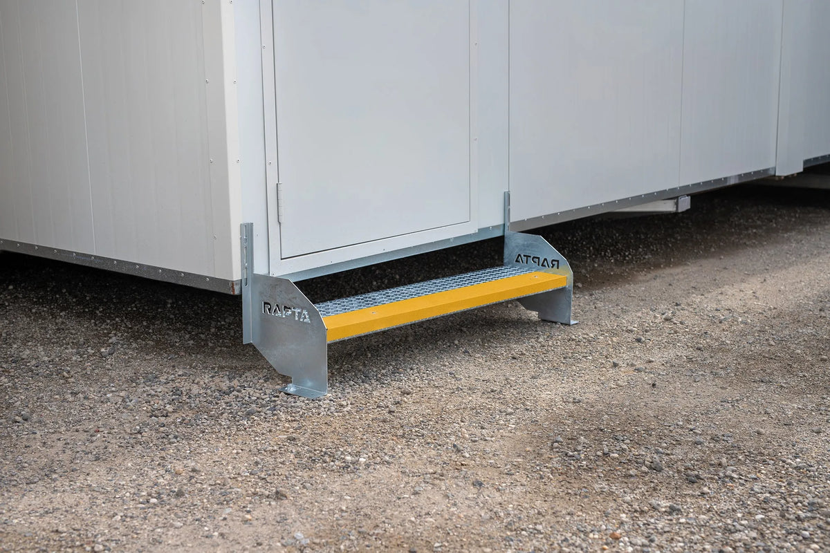 Rapta Heavy Duty Steel Steps - single - with yellow safety nosing installed at a modular building entrance