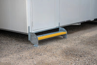 Rapta Heavy Duty Steel Steps - single - with yellow safety nosing installed at a modular building entrance