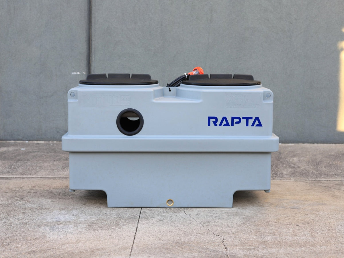 Front view of the RAPTA MiniLift 300 showing twin access lids, inlet opening and RAPTA branding.