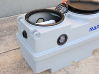 RAPTA MiniLift 300 with one access lid removed, showing the open chamber and internal pipework for service access.