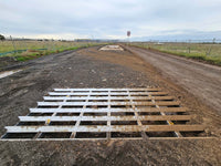 RAPTA Rumble Grid installed in-ground at a construction site access road to remove mud and debris from vehicle tyres