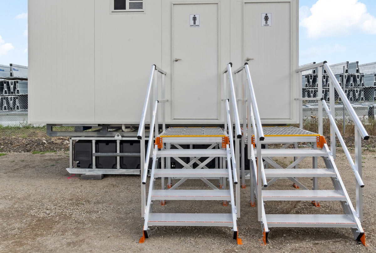 RAPTA waste water holding tank installed beneath a portable amenities building with access stairs