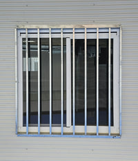 RAPTA 1250 x 1260mm galvanised window security grill installed on a modular building